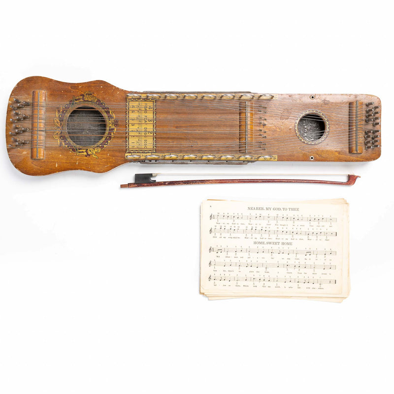 Ukelin String Intrument with Bow and Sheet Music